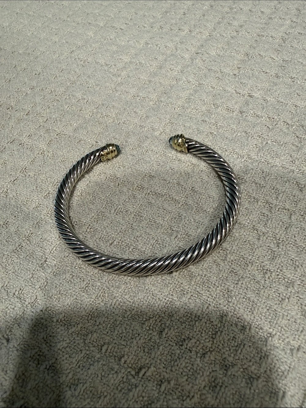 DY CLASSIC CABLE BRACELET
Sterling Silver w/ 18K Yellow Gold + Blue Topaz - Picture 2 of 6